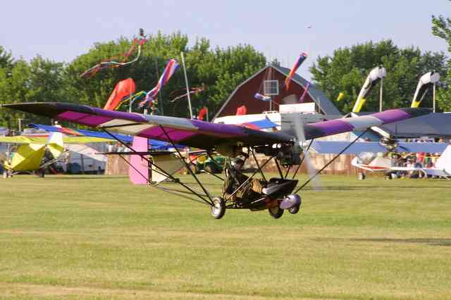Weedhopper single place Part 103 ultralight aircraft taking of at Airventure.