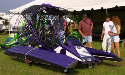 Paraski - Propulsion, amphibious powered parachute, with retractable chute.