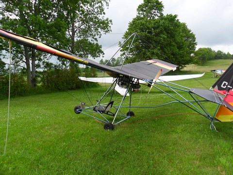 Quicksilver MX sitting in a field waiting to go flying