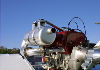 Rotax 503 aircraft engine with two Streamlined exhaust clamp kits installed.